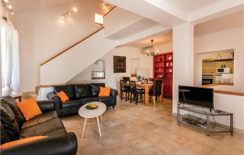 a living room with a couch and a tv and a table at Lovely Home In Kotor With Wifi in Kotor