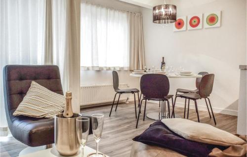 a living room with a couch and a table with chairs at Sun Garden in Ostend