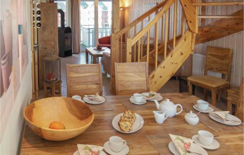 a wooden table with a bowl on top of it at Nice Apartment In Rechlin With Wifi in Rechlin