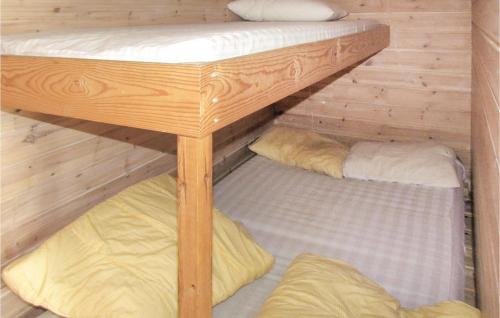 a couple of bunk beds in a wooden cabin at Cozy Home In Kleppe With House Sea View in Orre
