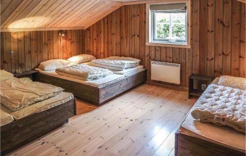 a room with four beds and a window at Amazing Home In Hemsedal With Sauna in Hemsedal