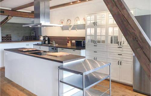 a kitchen with white cabinets and a counter top at Landhaus Dragun in Dragun