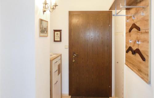 a wooden door in a room with a closet at Ferienwohnung Mit Seeblick in Sattendorf