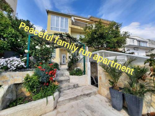 a sign that reads residential family unit appointment in front of a house at Apartment D&M1 in Makarska
