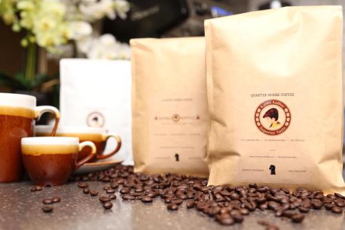 a bag of coffee beans and two cups of coffee at The Old Hall Hotel in Coventry