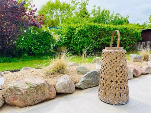 a wicker basket sitting in the middle of a garden at Seependance in Grömitz
