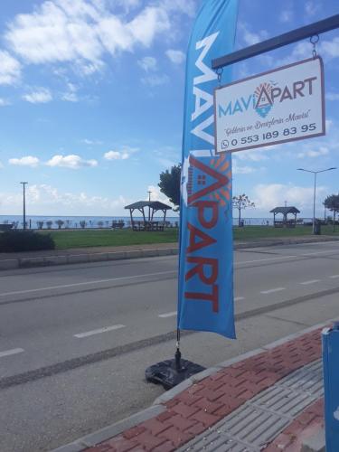 a street sign on the side of a road at Mavi Apart in Demre