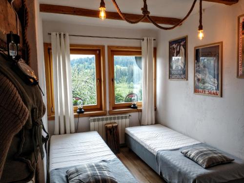 Postel nebo postele na pokoji v ubytování Za Siódmą Górą