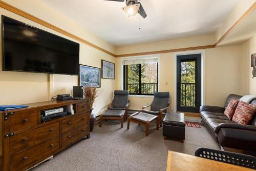 a living room with a large flat screen tv at 2767 Slopeside condo in Keystone