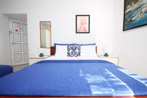 Postel nebo postele na pokoji v ubytování Apartmani Kukoljac