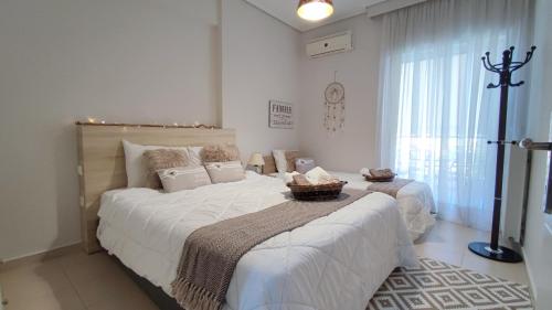 a bedroom with a large bed with a basket on it at Rock & Roll 2 - Modern apartment in Trikala in Tríkala