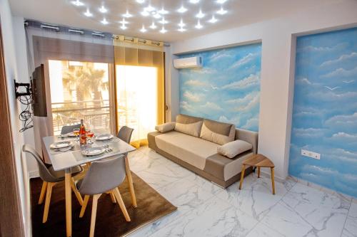 a living room with a couch and a table at RENT HOUSE ANEMOS in Iraklitsa