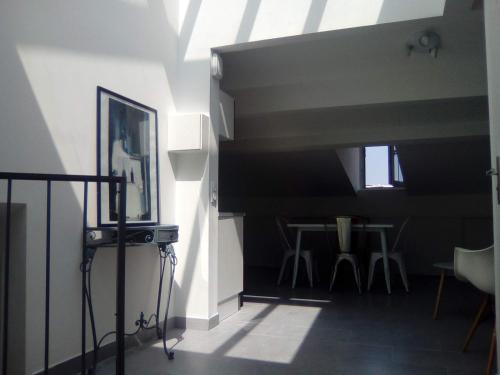 a living room with a window and a table at 3P Masséna Old Nice last stage in Nice