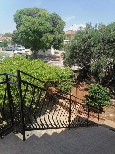 a group of benches sitting in a park at Apartments Vedrana in Ražanj