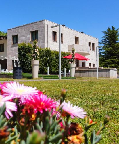a building with some flowers in front of it at Sotto Il Cielo Hotel in Pignola