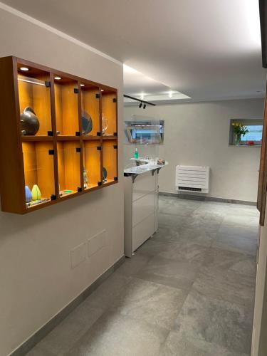 a kitchen with a counter and cabinets in a room at Le Petit Du Lac in Sirmione