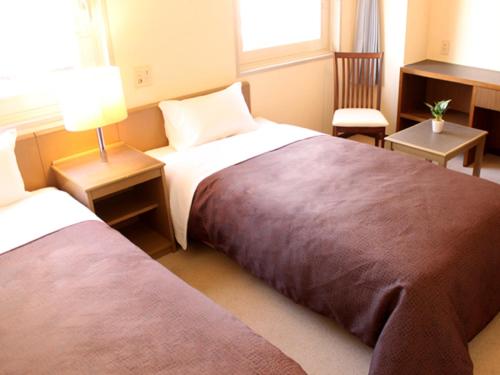 Postel nebo postele na pokoji v ubytování HOTEL LiVEMAX BUDGET Tokyo Kiba