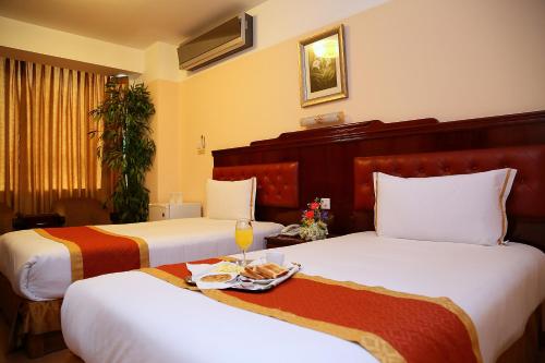 Una cama o camas en una habitación de Hotel Princesa