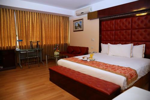 Hotel Princesa tesisinde bir odada yatak veya yataklar