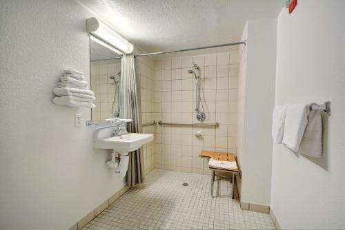 a bathroom with a sink and a shower at Motel 6-Newport, RI in Newport