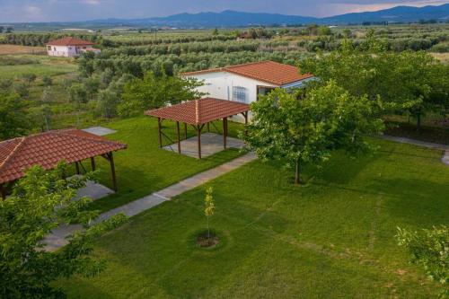 an overhead view of a yard with a house at Mama's Twin Houses by RentalsPro Agios Mamas Halkidiki in Áyios Mámas