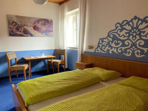 Un pat sau paturi într-o cameră la Wiesenhof