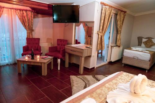 Postel nebo postele na pokoji v ubytování Ağva Carpediem Otel
