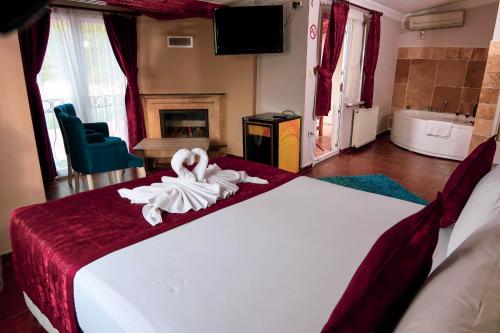 Postel nebo postele na pokoji v ubytování Ağva Carpediem Otel