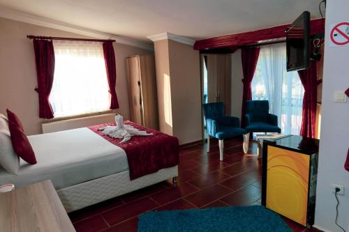 Postel nebo postele na pokoji v ubytování Ağva Carpediem Otel