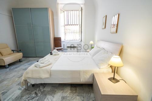 Säng eller sängar i ett rum på Eirene Exclusive Apartment