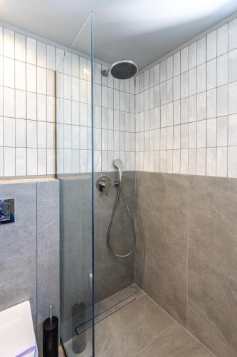 a shower with a glass door in a bathroom at Santa Maria City Hotel in Rhodes Town
