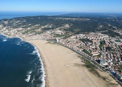 an aerial view of a beach next to the ocean at Sport Hostel Figueira da Foz in Figueira da Foz