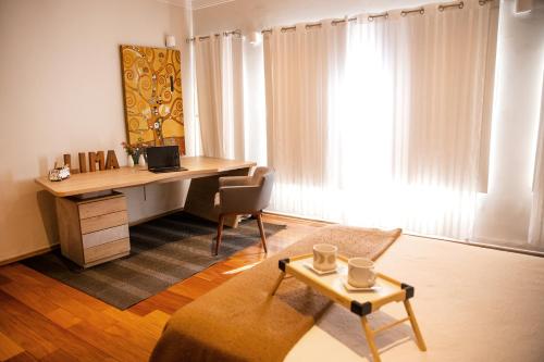 an office with a desk and a chair and a table at Casa Azul in Lima