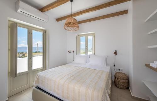 Katil atau katil-katil dalam bilik di Milos Zen Suites