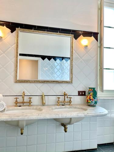 a bathroom with a sink and a mirror at Villa Conti in Fauglia