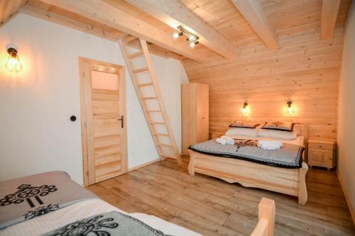 Ένα ή περισσότερα κρεβάτια σε δωμάτιο στο Tatras Residence