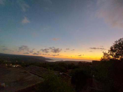 a view of the sunset from the top of a hill at Elgina Apartments2 MANI in Mína