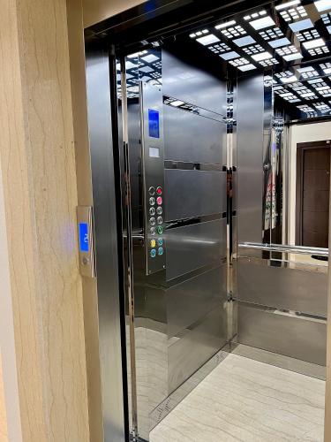 a large stainless steel refrigerator in a building at Kaljevic 13 in Bar