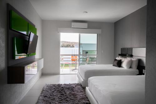 Hotel Aquetzalliにあるベッド