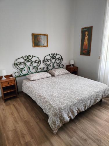 a bedroom with a bed with a white comforter at Accanto al Duomo in Florence