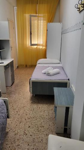 Ένα ή περισσότερα κρεβάτια σε δωμάτιο στο Hotel Viscount