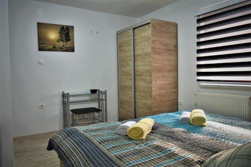 Posteľ alebo postele v izbe v ubytovaní Guest House Tonka