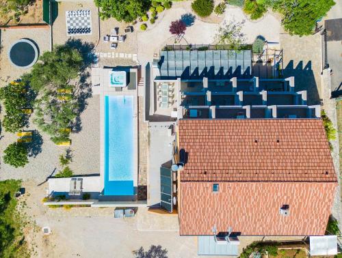 an overhead view of a building with a pool at Villa Sunce in Punat