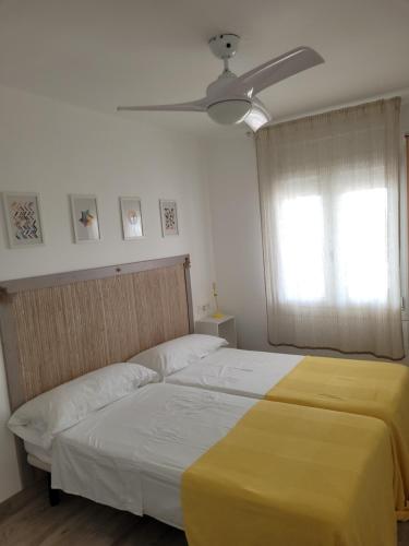 Ένα ή περισσότερα κρεβάτια σε δωμάτιο στο Apartamento Apolo