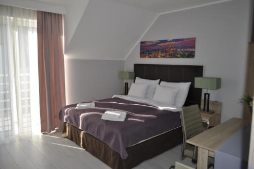 Ein Bett oder Betten in einem Zimmer der Unterkunft Olimpia House
