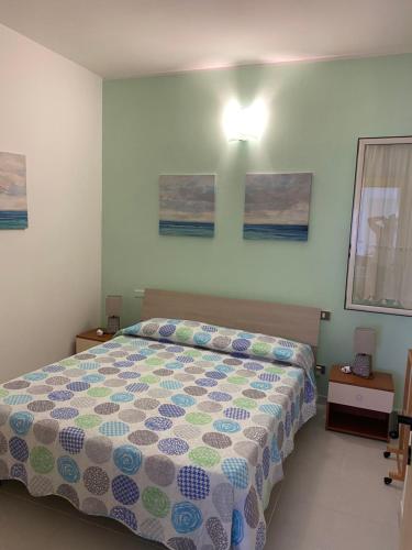 Katil atau katil-katil dalam bilik di Appartamento nel cuore di Villasimius