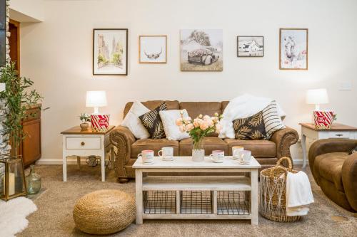 a living room with a couch and a table at Luxe Quiet Townhouse w/Parking/Pool/By Dollywood in Pigeon Forge