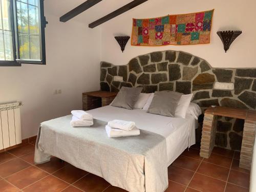 Postel nebo postele na pokoji v ubytování Mayte Dreams Caminito Del Rey