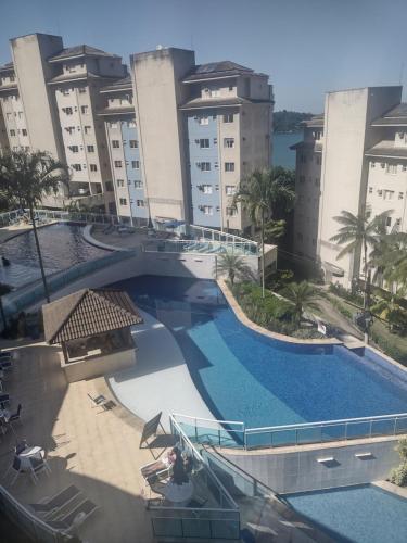 an overhead view of a swimming pool in front of buildings at Porto Real Resort Suites 1 in Mangaratiba