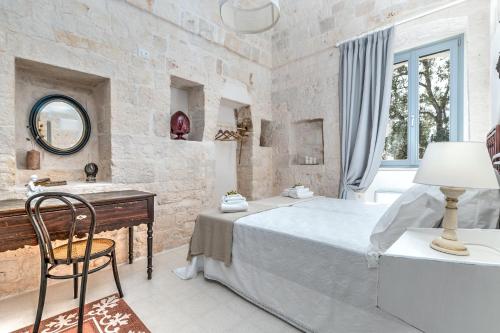 Ένα ή περισσότερα κρεβάτια σε δωμάτιο στο Borgo Altobello